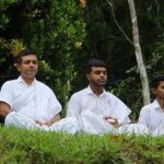 person meditating outdoors