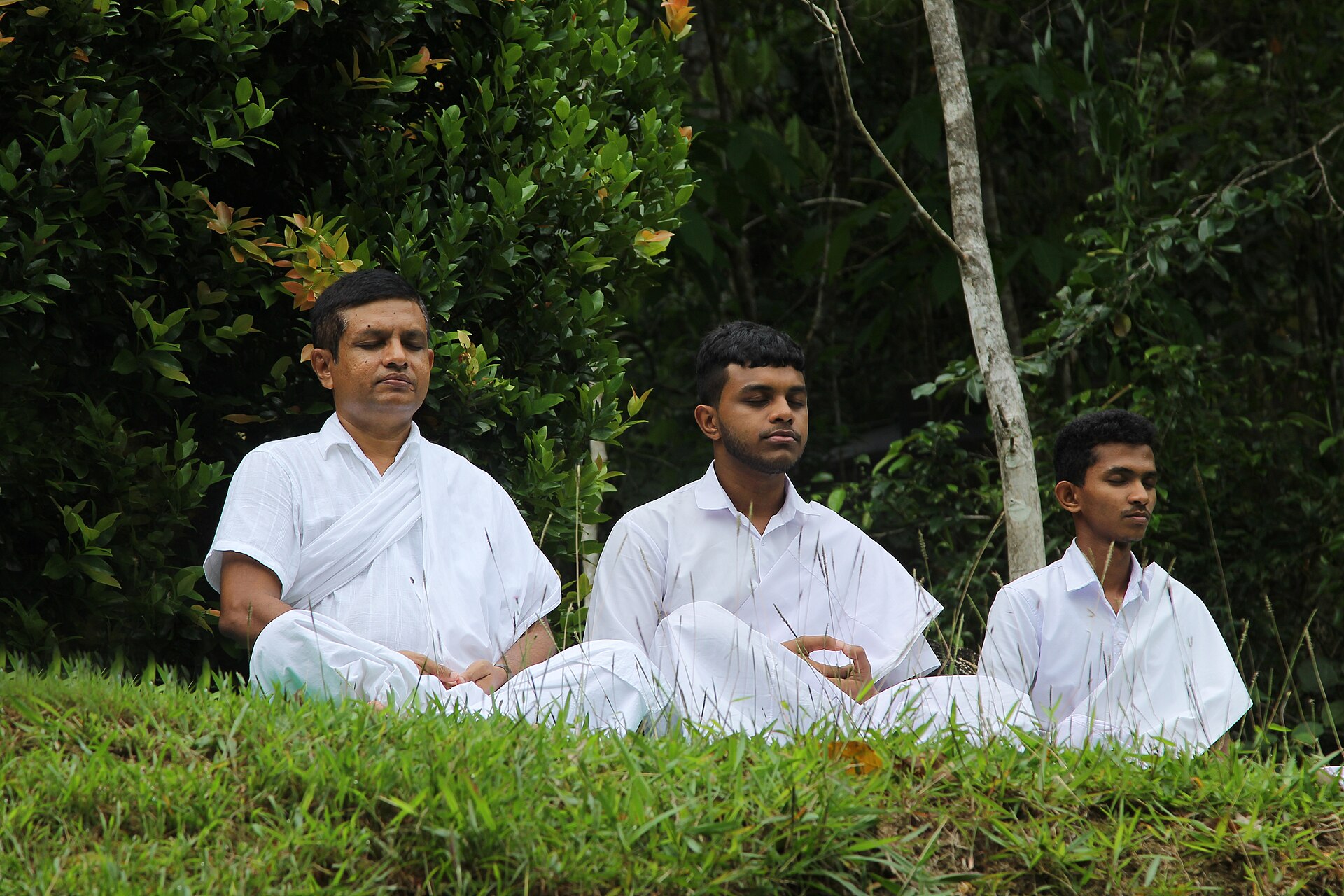 person meditating outdoors